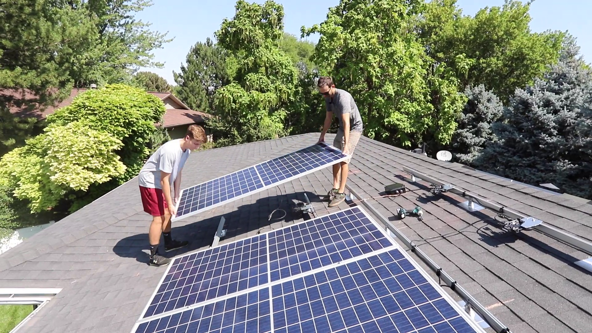 Installing solar panels on a roof of a house